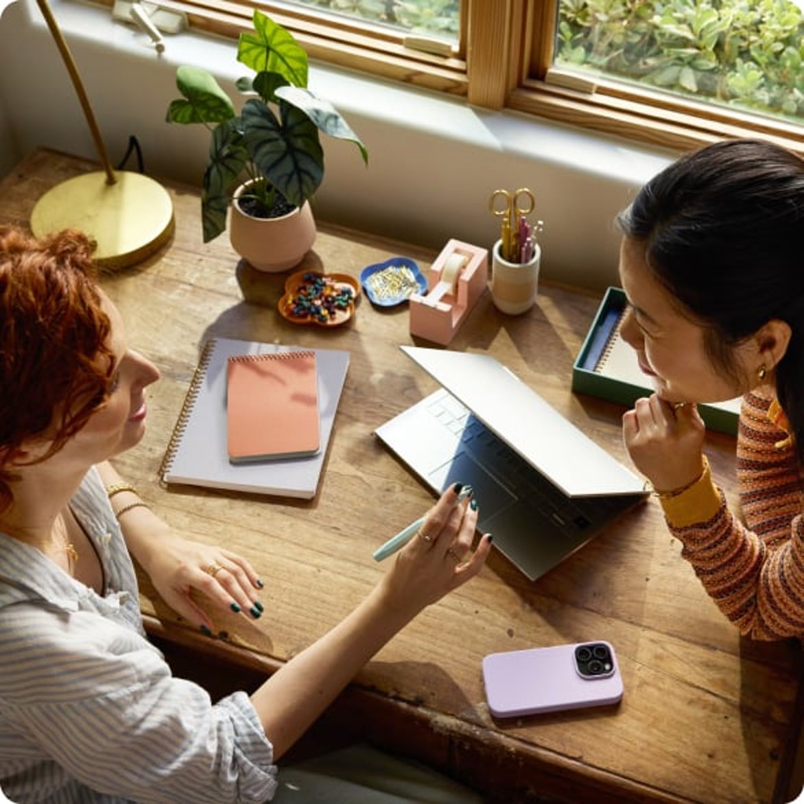 Two coworkers collaborating at a table