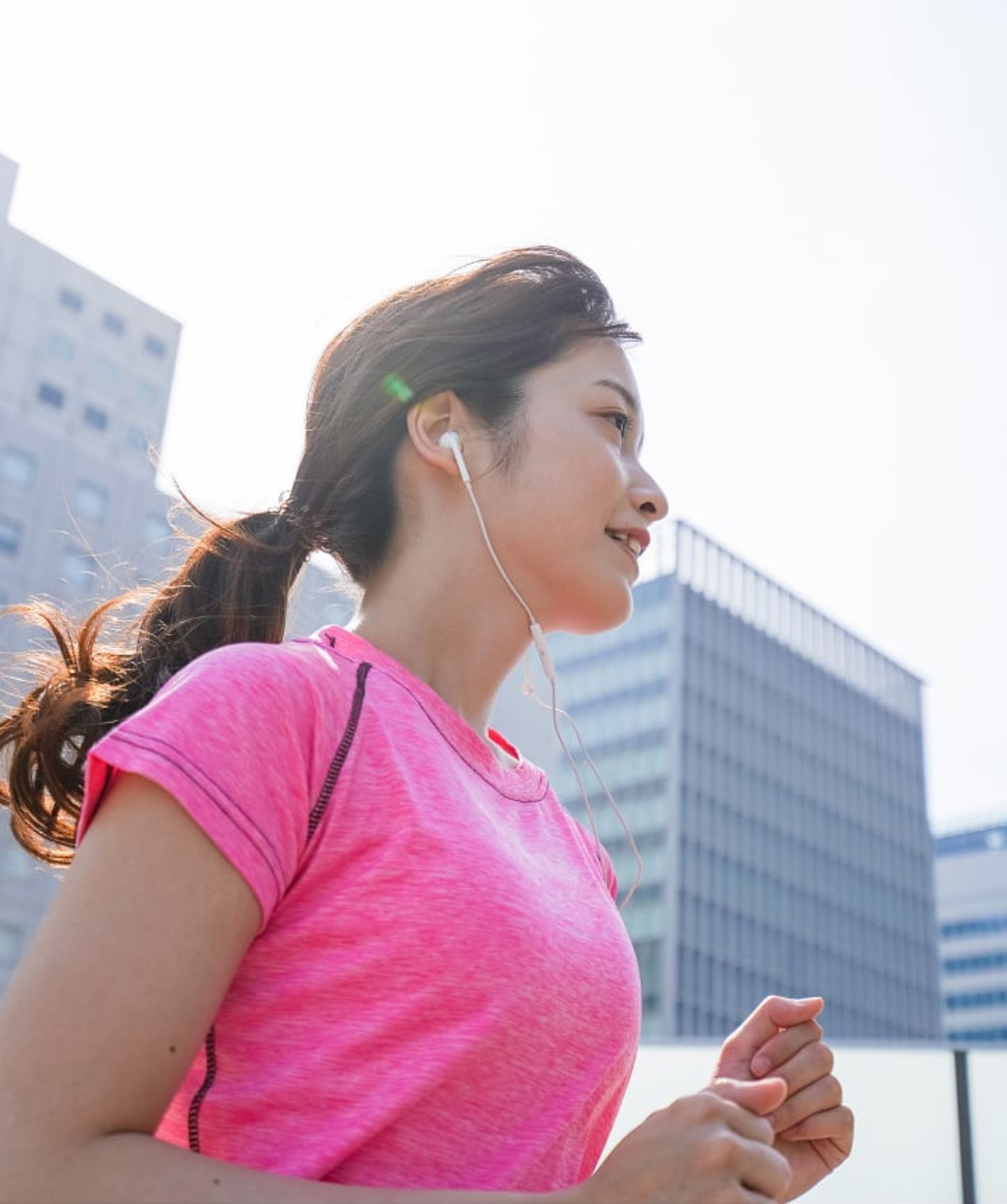 Woman running and listening to music