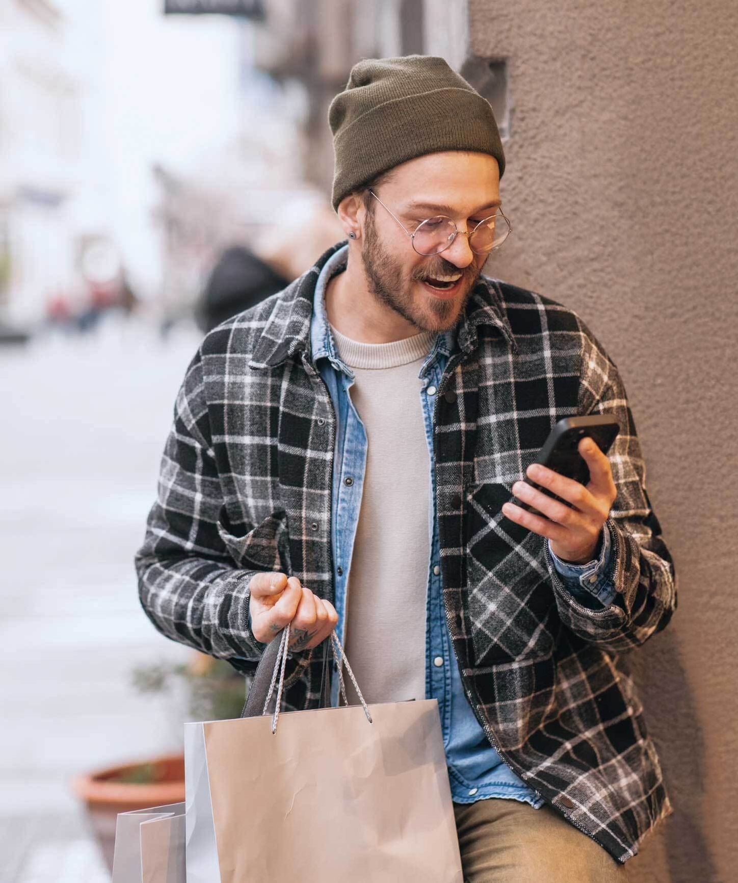 Man shopping and looking at his phone