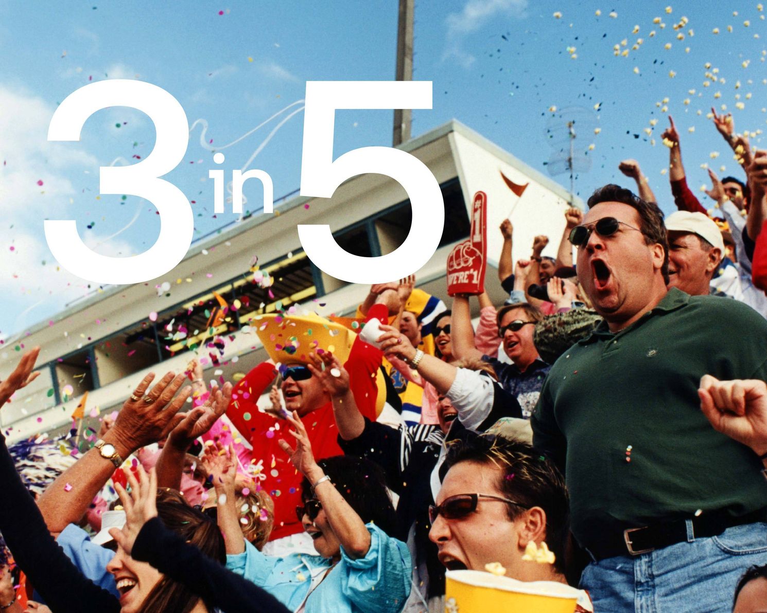 Fans cheering at a sporting event with the numbers 3 in 5 overlaid in white text.