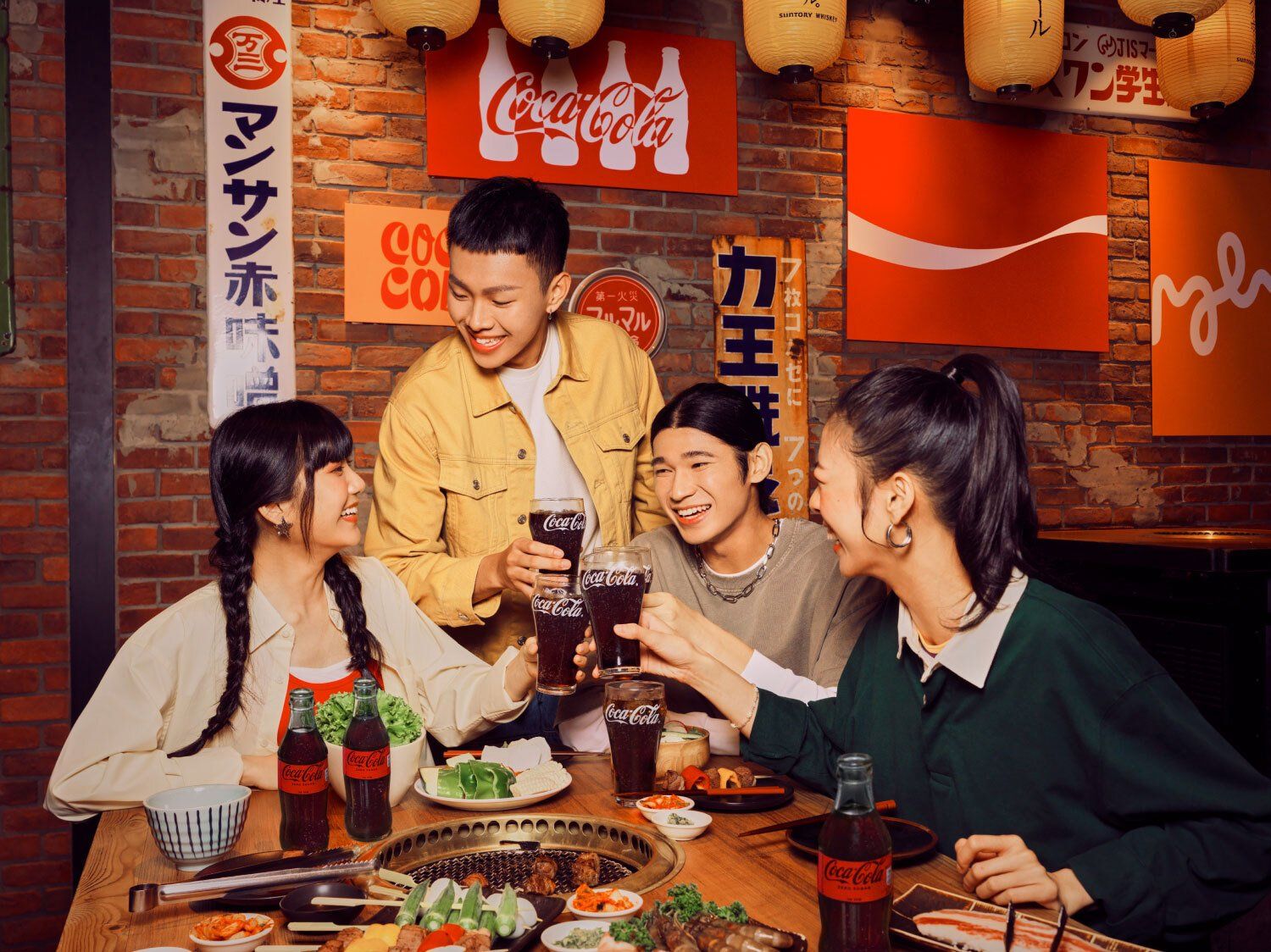 Group of people with glasses of Coca Cola