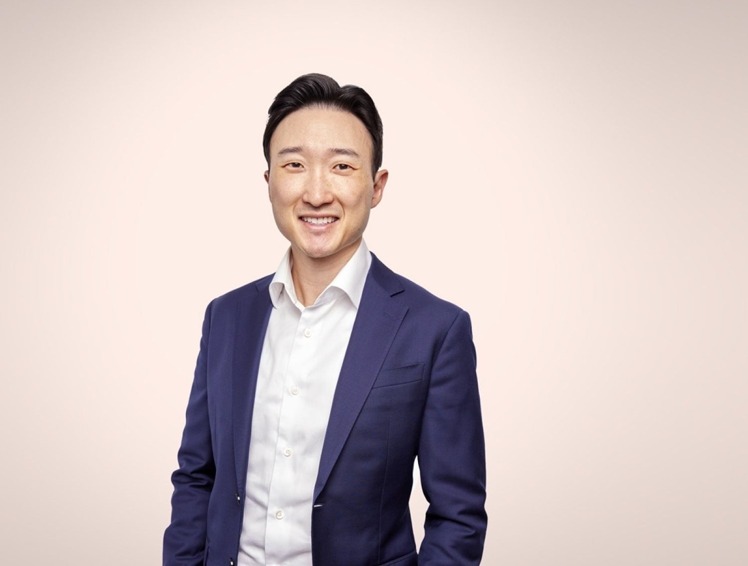 Bryce from The Trade Desk in front of a tan background