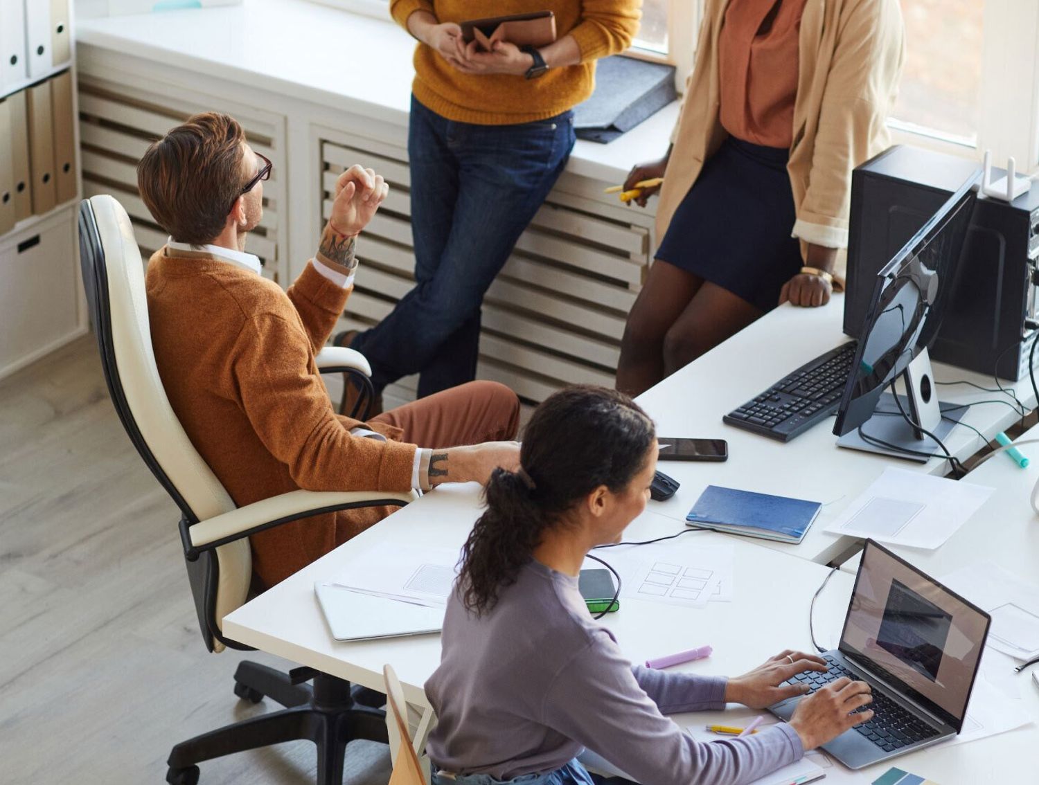 Coworkers all gathered in a common space