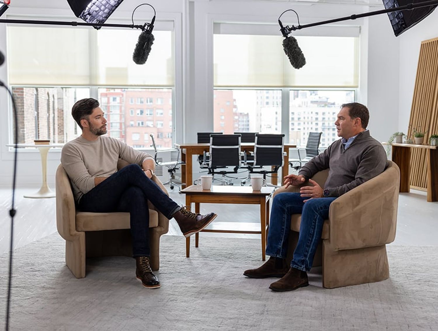 Dave DeRobbio and Jeff Daniel in filmed interview conversation with studio setup.