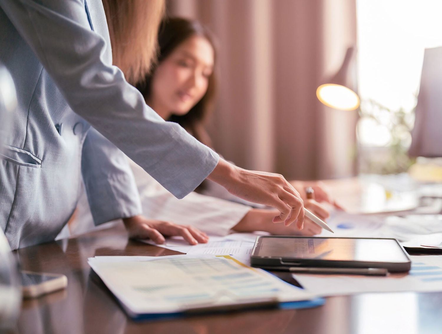 Two people working together at a desk