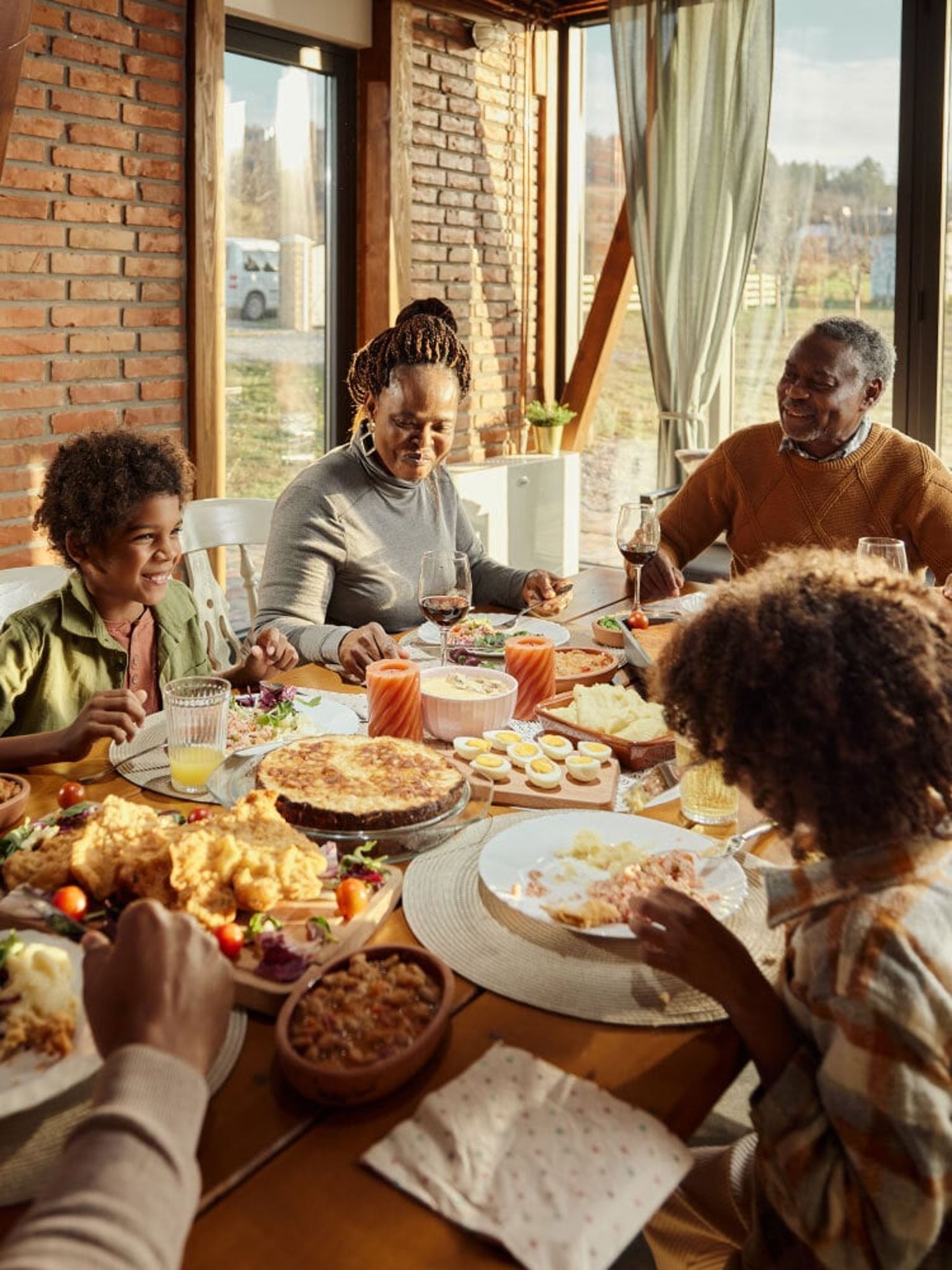 Family all gathered around a dinner table