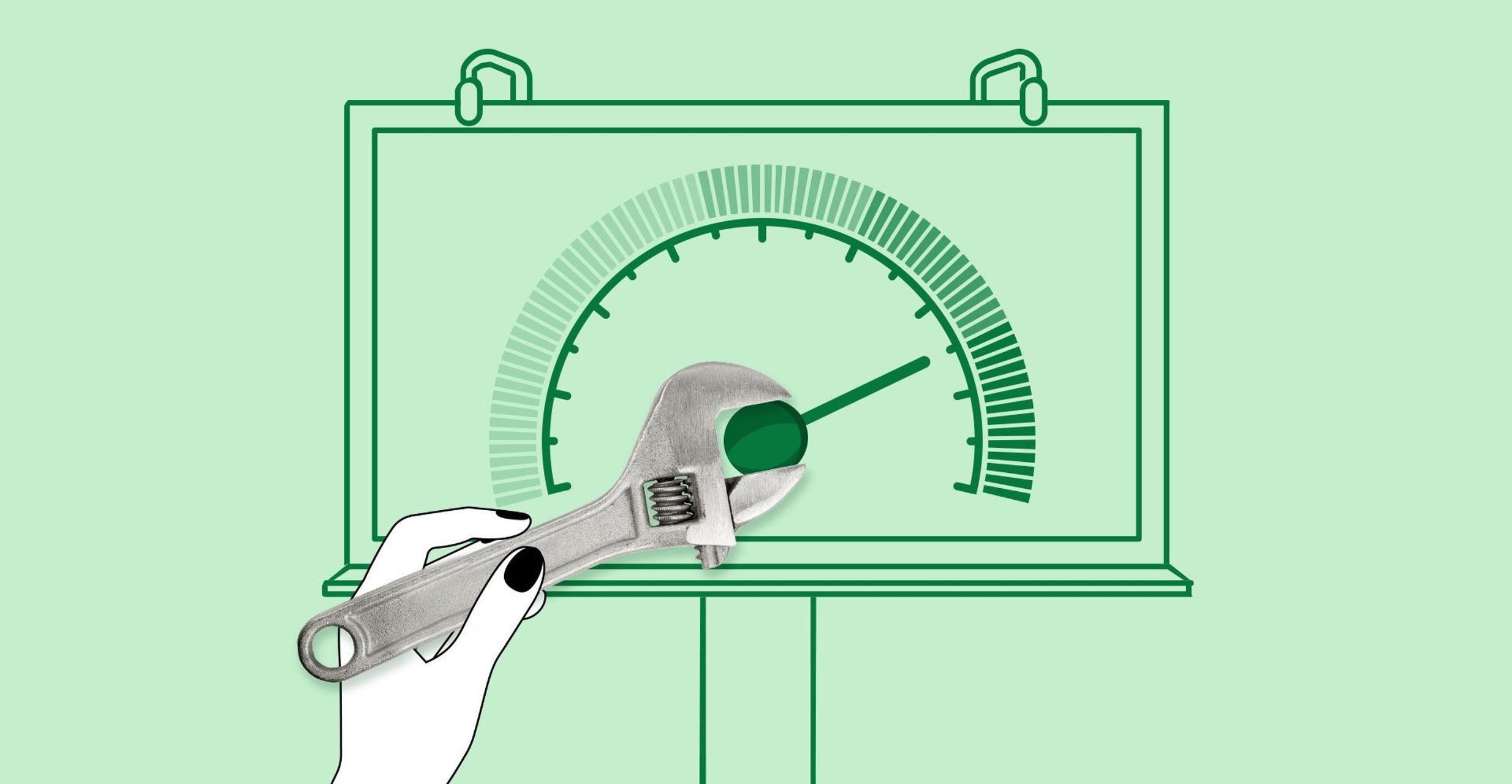 A hand uses a wrench to spin a dial on a display