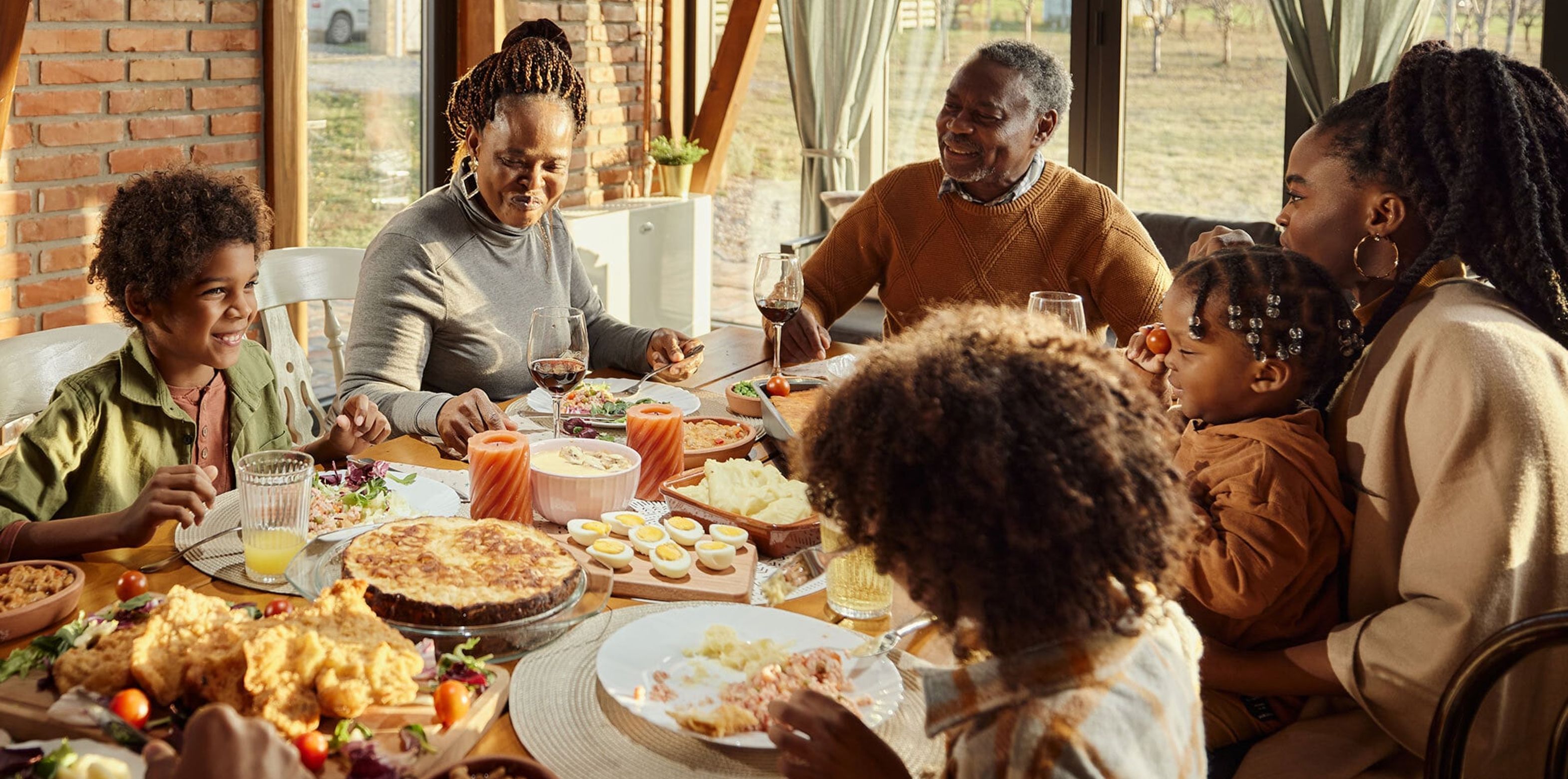 Family all gathered around a dinner table