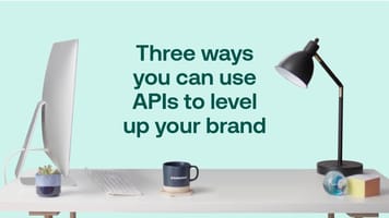 Three ways you can use APIs to level up your brand - green text placed over an image of a desk