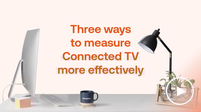 Desk with computer, lamp, and plants beside ‘Measure Connected TV effectively’ text by The Trade Desk, showing CTV analytics.