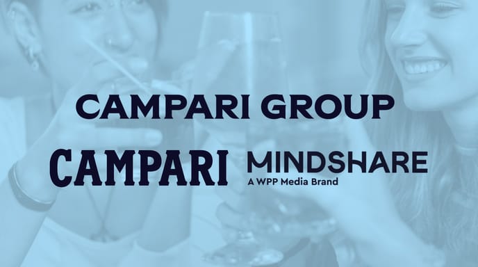 Overlay text reading “Campari Group” and “Campari Mindshare, a WPP Media Brand” displayed over a background of people toasting with cocktails.
