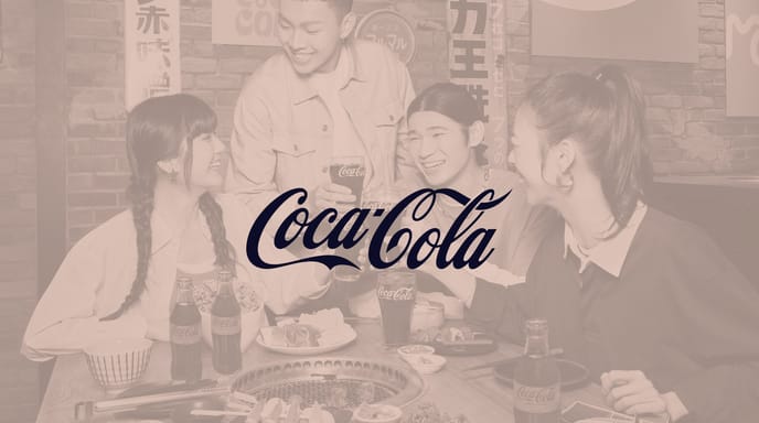 Group of people with glasses of Coca Cola