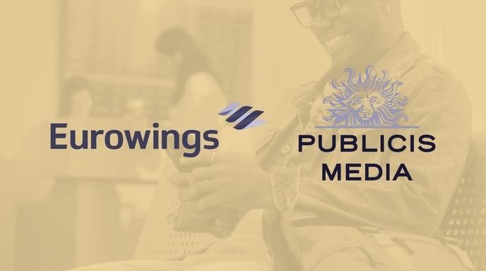 Eurowings and Publicis Media logos displayed over a tinted background of a man using his phone in a modern indoor setting.