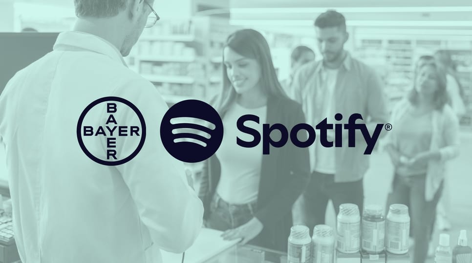 Group of people making purchases in a pharmacy with a green shade over and Bayer and Spotify logos in the center