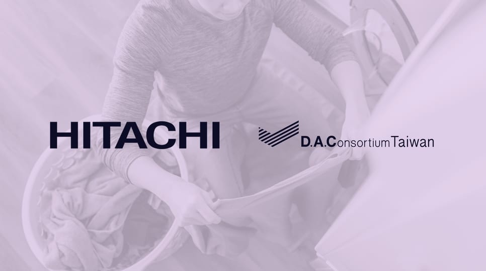 Logos of Hitachi, D.A. Consortium Taiwan, and The Trade Desk displayed over a background image of a person loading laundry into a washing machine.