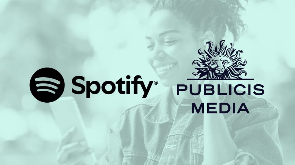 Spotify and Publicis Media logos displayed over a tinted background of a woman using a phone to listen to music with headphones on.