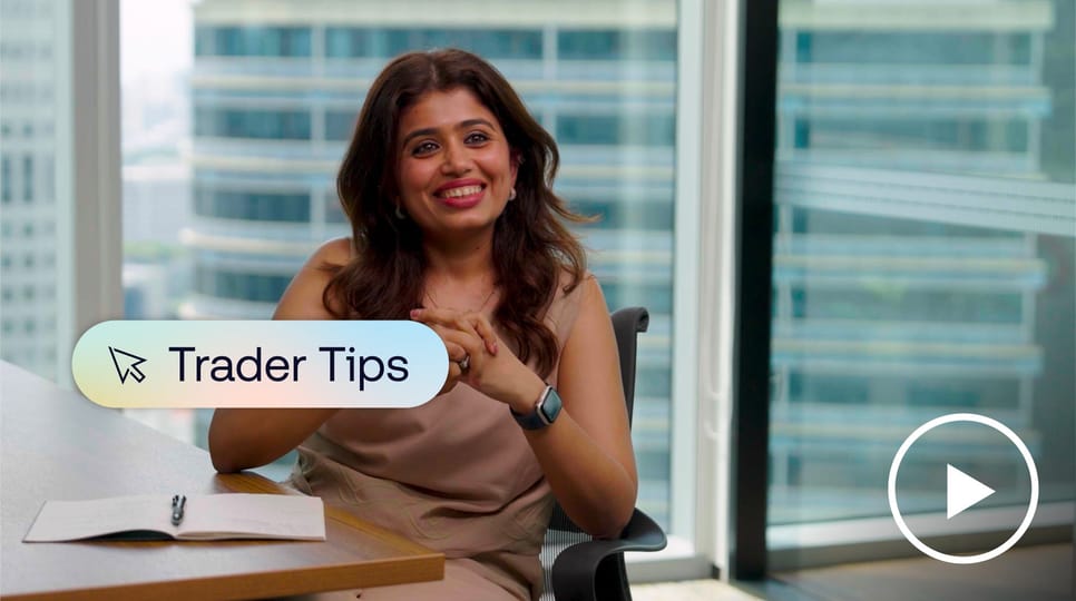 Smiling woman sitting at desk in city office.