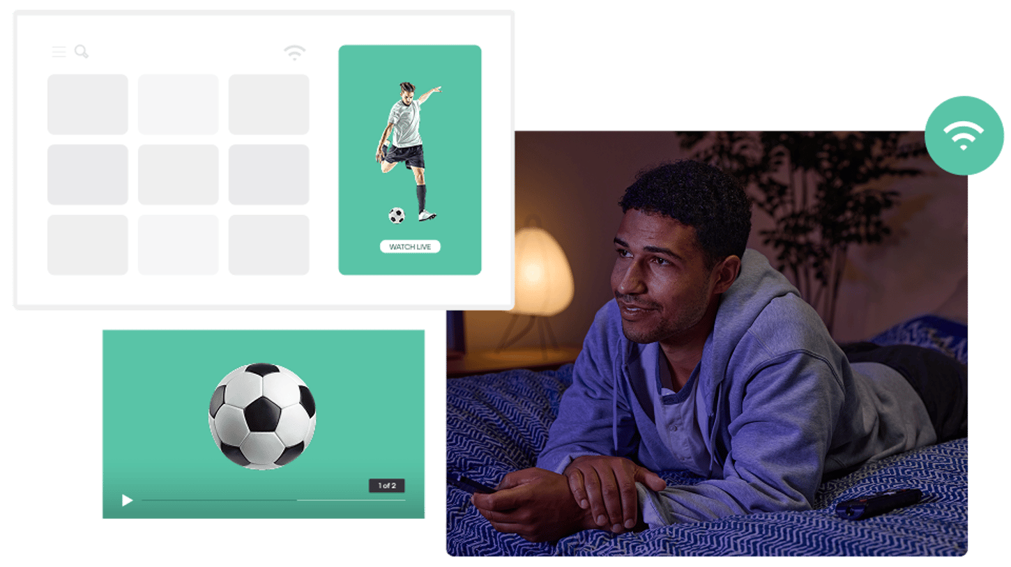 A man watching a soccer match on a streaming platform while lying on a bed, with digital interface elements showing live match options and video content.