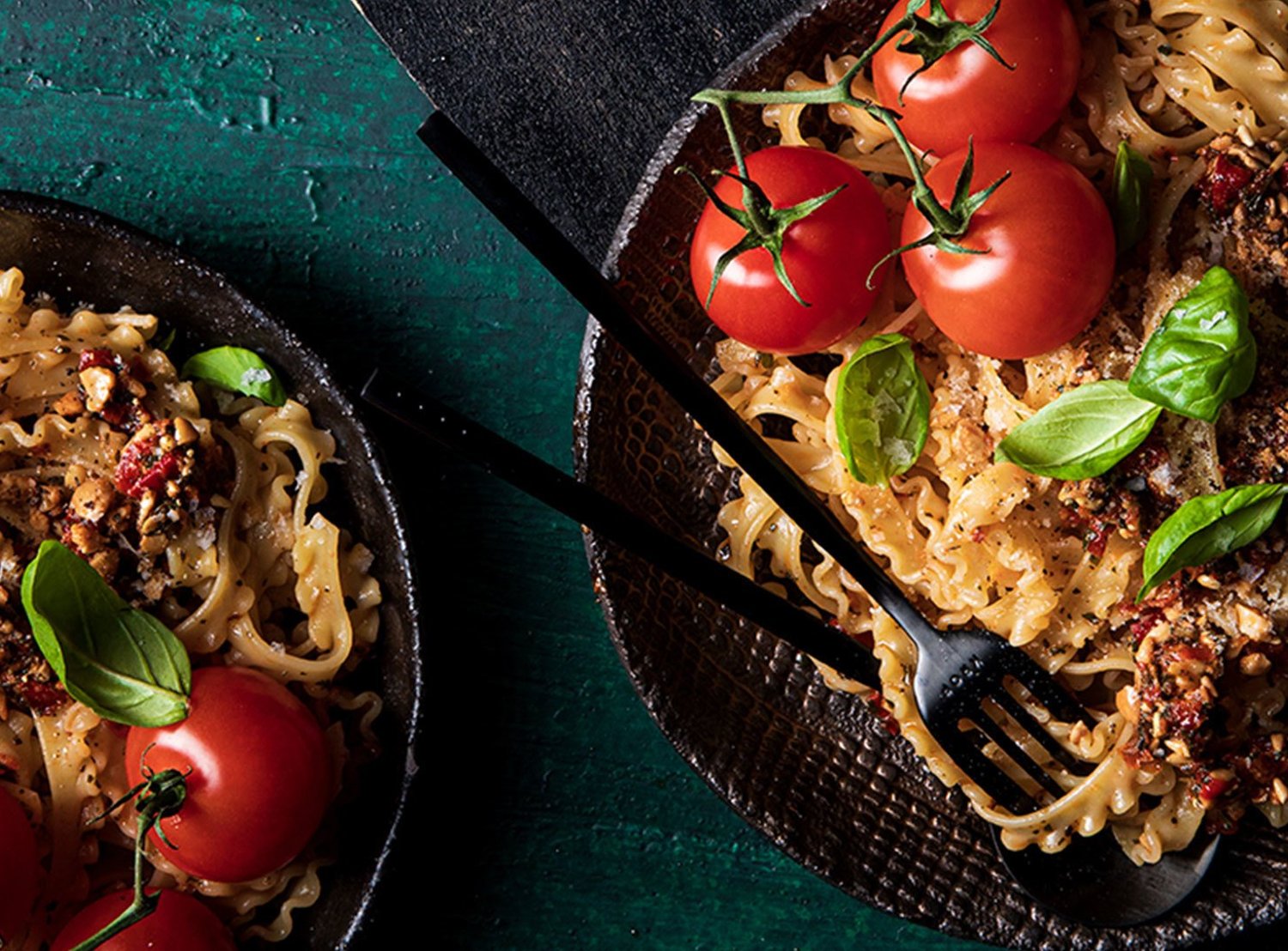 Two plates filled with pasta