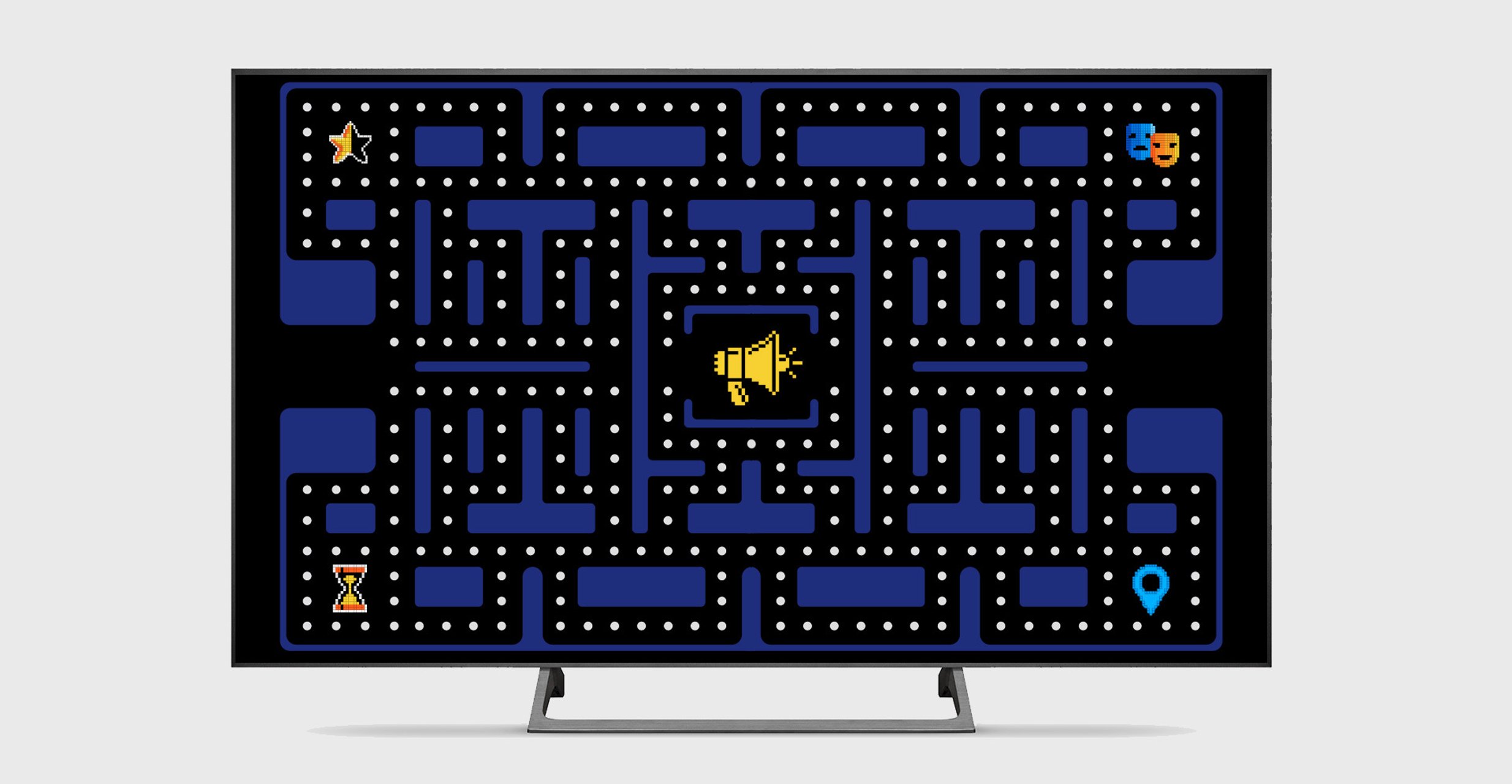 Pacman like game on a TV with a megaphone in the middle of the maze