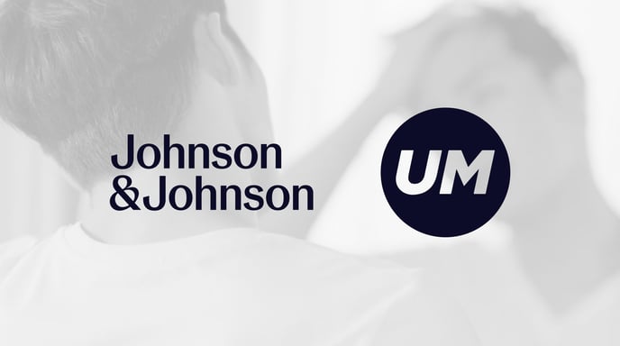 A man looks at himself in the mirror while running his hand through his hair, overlaid with the Johnson & Johnson and UM logos on a monochrome background.
