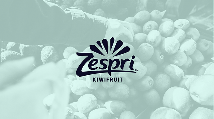 Image of a hand reaching into a pile of kiwis with a green wash over and the Zespri logo over top