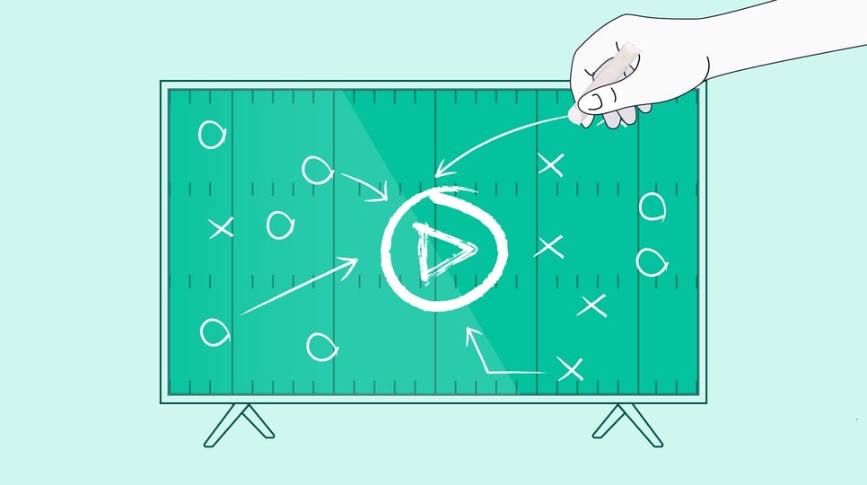 A TV shows a drawing of a football play diagram with a play button in the center