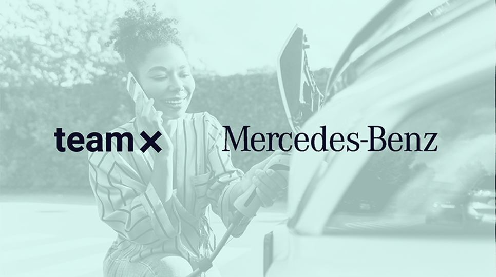 A promotional image with a cool-toned filter, featuring the Team X, Mercedes-Benz, and The Trade Desk logos over a background of a smiling woman on the phone while charging an electric vehicle.