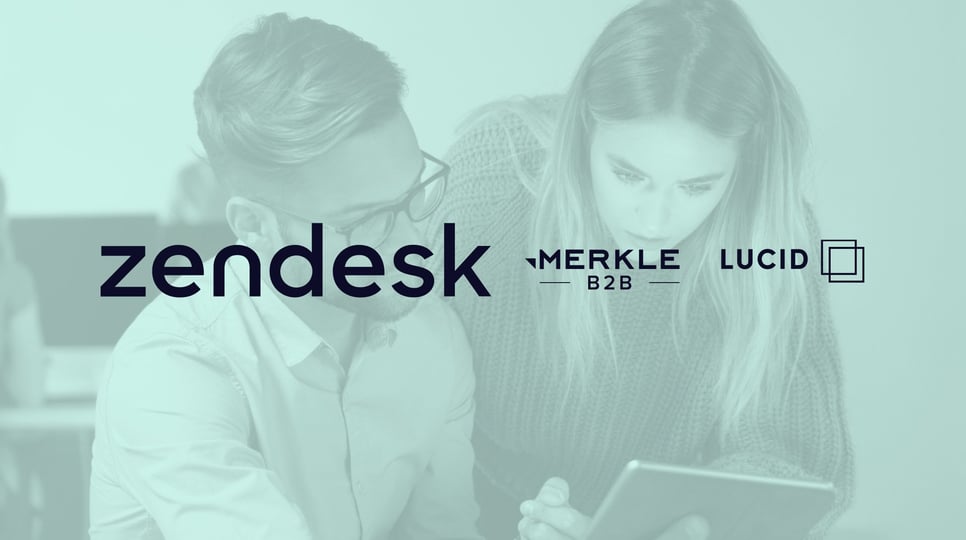 A man and woman work together on a tablet, overlaid with logos for Zendesk, Merkle B2B, Lucid, and The Trade Desk.